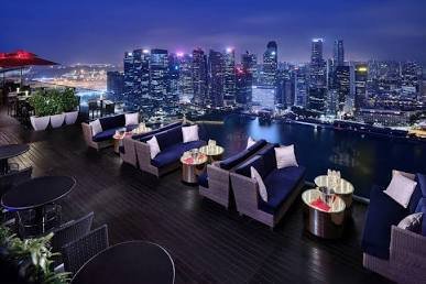 Night skyline views from a rooftop cocktail lounge in Singapore